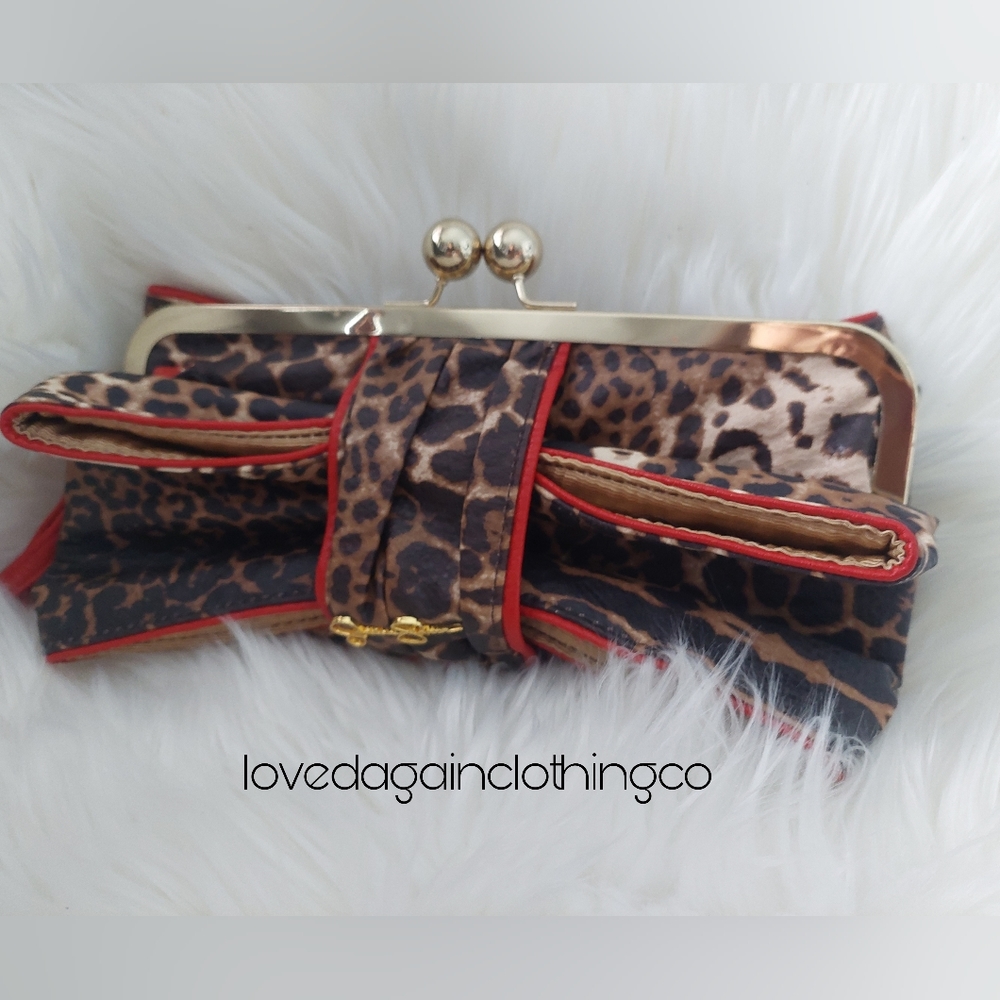 Jessica Simpson clutch wristlet in cheetah print with red trim
